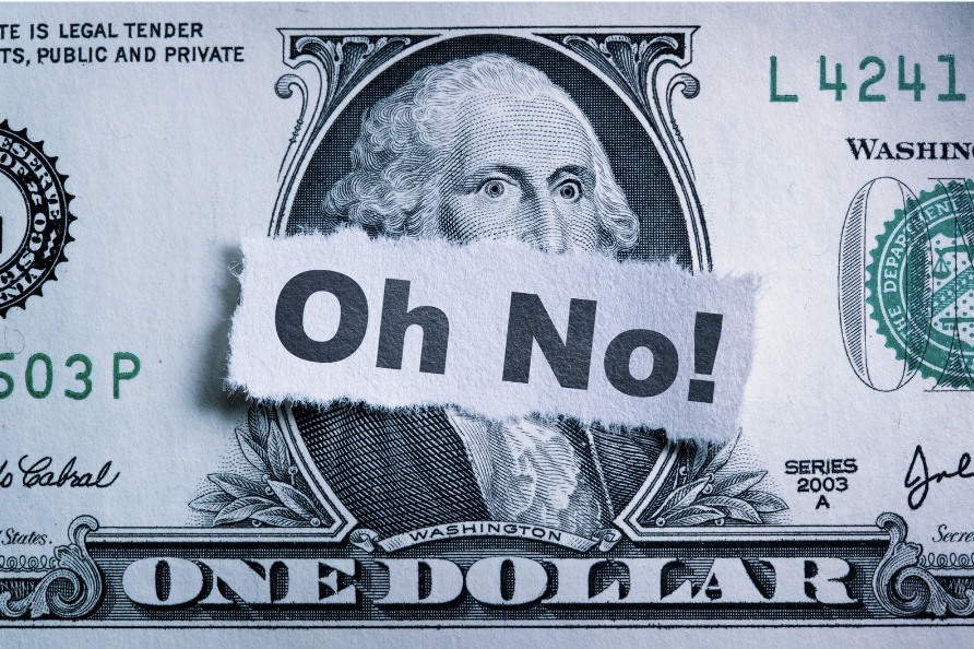 Dollar bill with the word 'oh no' on it - demonstrating the mistakes people make when filing taxes